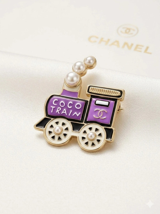 Chanel. Jewelry - Co-Co Train Brooch in Pink & Gold Like New
